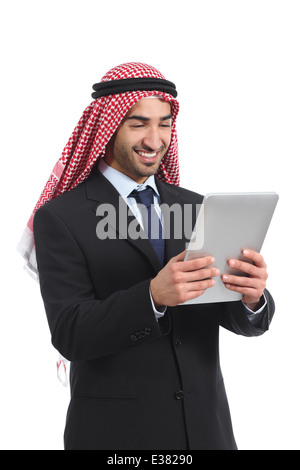 Arab saudi businessman reading a tablet reader isolated on a white background Stock Photo