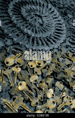 Close up of keys piles with shallow depth of field. Dramatic image with patterns. Gold and blue tinted vertical photograph Stock Photo