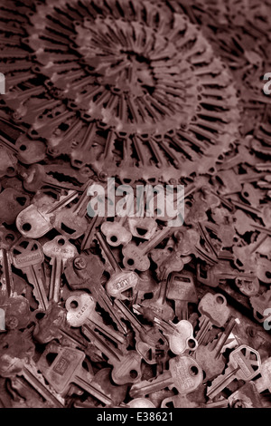 Close up of keys piles with shallow depth of field. Dramatic image with patterns. Rich sepia toned vertical photograph Stock Photo