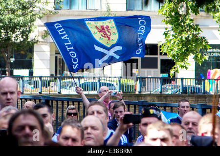 Scottish football fans, known as the Tartan Army, ascend on the William Wallace memorial in London ahead of their friendly game Stock Photo