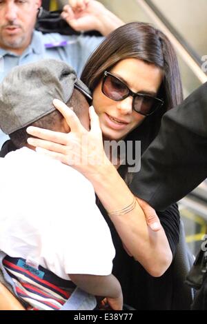 Sandra Bullock, along with her son Louis and a bodyguard, arrive at ...