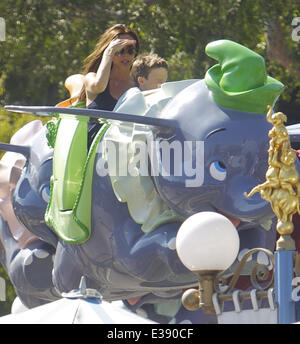 David and Victoria Beckham spend quality time with their kids at Disneyland. The famous family spent lots of time in Fantasyland, riding the Dumbo ride, a carousel and a children's train. Little Harper was spotted enjoying a carousel ride with her brother Stock Photo