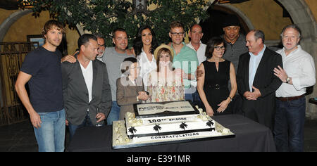 Cast and crew of NCIS: LOS ANGELES on set for a cake-cutting to celebrate the filming of their 100th episode.  (Episode to air on Tuesday, October 15th)  Featuring: Eric Christian Olsen,R. Scott Gemmill,John Peter Kousakis,Chris O'Donnell,Daniela Ruah,Linda Hunt,Renée Felice Smith,Barrett Foa,LL Cool J,Shane Brennan Where: LA, CA, United States When: 23 Aug 2013niel Tanner/WENN.com Stock Photo