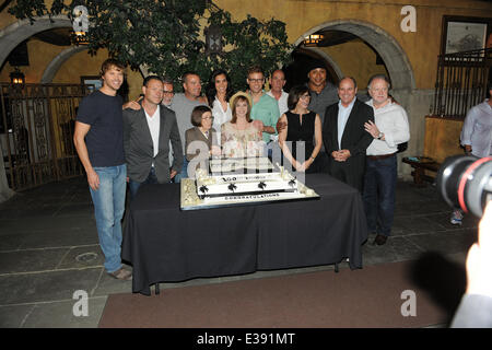 Cast and crew of NCIS: LOS ANGELES on set for a cake-cutting to celebrate the filming of their 100th episode.  (Episode to air on Tuesday, October 15th)  Featuring: Eric Christian Olsen,R. Scott Gemmill,John Peter Kousakis,Chris O'Donnell,Daniela Ruah,Lin Stock Photo