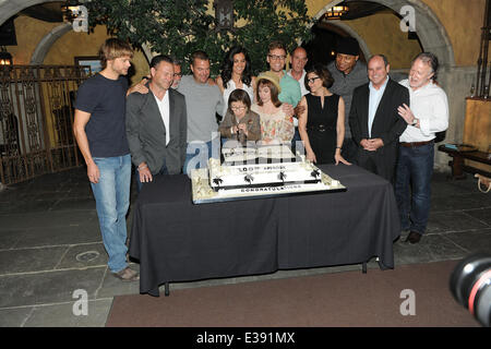 Cast and crew of NCIS: LOS ANGELES on set for a cake-cutting to celebrate the filming of their 100th episode.  (Episode to air on Tuesday, October 15th)  Featuring: Eric Christian Olsen,R. Scott Gemmill,John Peter Kousakis,Chris O'Donnell,Daniela Ruah,Linda Hunt,Renée Felice Smith,Barrett Foa,LL Cool J,Shane Brennan Where: LA, CA, United States When: 23 Aug 2013 Stock Photo