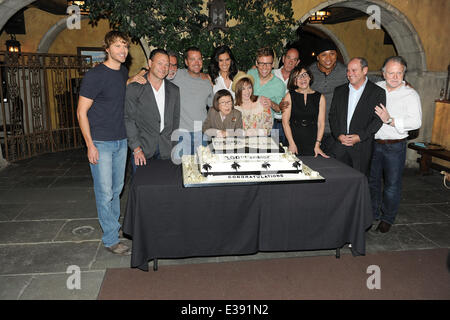 Cast and crew of NCIS: LOS ANGELES on set for a cake-cutting to celebrate the filming of their 100th episode.  (Episode to air on Tuesday, October 15th)  Featuring: Eric Christian Olsen,R. Scott Gemmill,John Peter Kousakis,Chris O'Donnell,Daniela Ruah,Linda Hunt,Renée Felice Smith,Barrett Foa,LL Cool J,Shane Brennan Where: LA, CA, United States When: 23 Aug 2013 Stock Photo