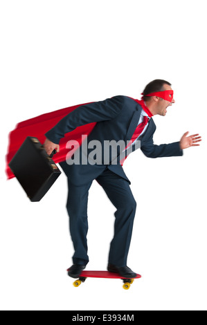 superhero businessman riding on a skateboard skateboarding isolated on white Stock Photo