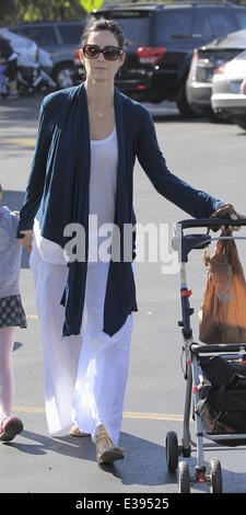 Actress, Carrie-Anne Moss and her daughter heading to the local Farmers Market in Brentwood  Featuring: Carrie-Anne Moss Where: Brentwood, CA, United States When: 25 Aug 2013 Stock Photo