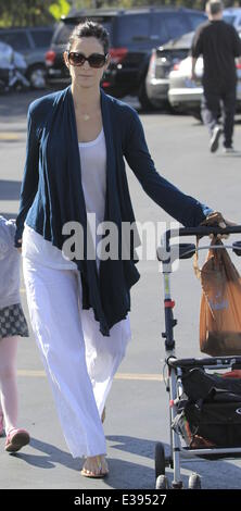 Actress, Carrie-Anne Moss and her daughter heading to the local Farmers Market in Brentwood  Featuring: Carrie-Anne Moss Where: Brentwood, CA, United States When: 25 Aug 2013 Stock Photo