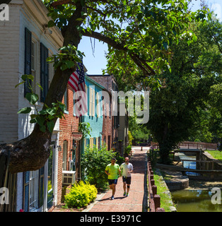 Washington DC. Runners on the Chesapeake and Ohio Canal towpath in downtown Georgetown, Washington DC, USA Stock Photo