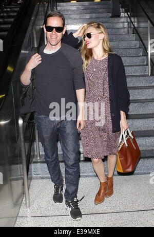 Newlyweds Kate Bosworth and Michael Polish arrive at LAX airport on a flight. The couple married on Saturday (31Aug) during an outdoor ceremony at The Ranch at Rock Creek in Philipsburg, Montana.  Featuring: Kate Bosworth,Michael Polish Where: Los Angeles Stock Photo