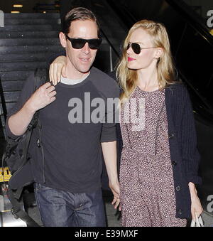 Newlyweds Kate Bosworth and Michael Polish arrive at LAX airport on a flight. The couple married on Saturday (31Aug) during an o Stock Photo