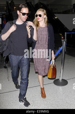 Newlyweds Kate Bosworth and Michael Polish arrive at LAX airport on a flight. The couple married on Saturday (31Aug) during an outdoor ceremony at The Ranch at Rock Creek in Philipsburg, Montana.  Featuring: Kate Bosworth,Michael Polish Where: Los Angeles, California, United States When: 03 Sep 2013 Stock Photo