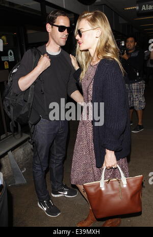 Newlyweds Kate Bosworth and Michael Polish arrive at LAX airport on a flight. The couple married on Saturday (31Aug) during an outdoor ceremony at The Ranch at Rock Creek in Philipsburg, Montana.  Featuring: Kate Bosworth,Michael Polish Where: Los Angeles Stock Photo