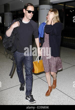 Newlyweds Kate Bosworth and Michael Polish arrive at LAX airport on a flight. The couple married on Saturday (31Aug) during an outdoor ceremony at The Ranch at Rock Creek in Philipsburg, Montana.  Featuring: Kate Bosworth,Michael Polish Where: Los Angeles Stock Photo