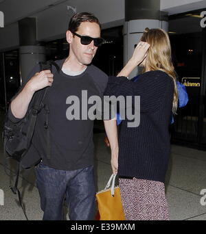 Newlyweds Kate Bosworth and Michael Polish arrive at LAX airport on a flight. The couple married on Saturday (31Aug) during an o Stock Photo