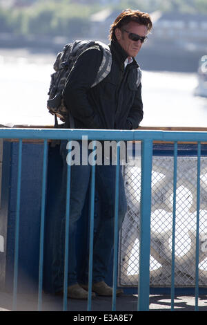 Actor Sean Penn filming the his new movie 'The Gunman' on Tower Bridge in London. The scene features a helicopter flying low over the iconic London landmark as Penn walks across the River Thames  Featuring: Sean Penn Where: London, United Kingdom When: 08 Sep 2013 Stock Photo