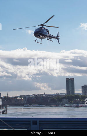 Actor Sean Penn filming the his new movie 'The Gunman' on Tower Bridge in London. The scene features a helicopter flying low over the iconic London landmark as Penn walks across the River Thames  Featuring: Sean Penn Where: London, United Kingdom When: 08 Stock Photo