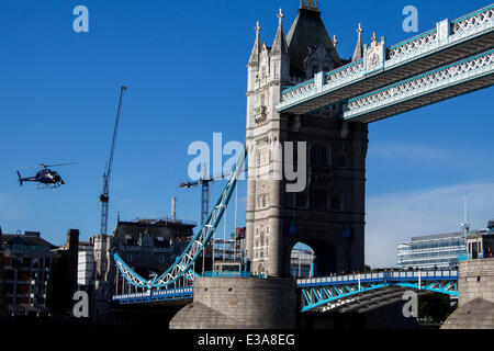 Actor Sean Penn filming the his new movie 'The Gunman' on Tower Bridge in London. The scene features a helicopter flying low over the iconic London landmark as Penn walks across the River Thames  Featuring: Sean Penn Where: London, United Kingdom When: 08 Stock Photo