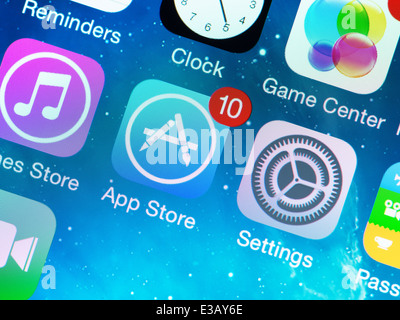 A close-up photo of Apple iPhone 5s start screen with application icons, includes App Store, Settings, Clock, Game Center Stock Photo