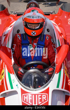 Spielberg, Austria. 22nd June, 2014. The non-executive chairman of Mercedes AMG, former Austrian Formula One driver Niki Lauda, steers his 1976 Ferrari 312T2 prior to the start of the 2014 Formula One Grand Prix of Austria at the Red Bull Ring race track in Spielberg, Austria, 22 June 2014. Photo: David Ebener/dpa/Alamy Live News Stock Photo