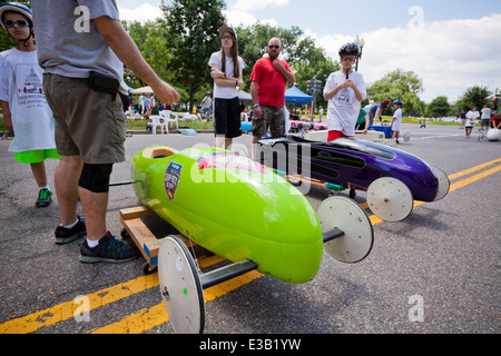 Children and parents inspecting cars at the annual soap box derby - Washington, DC USA Stock Photo