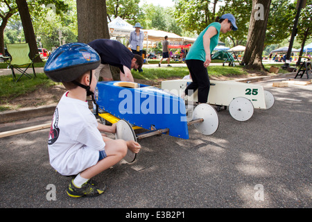 Children and parents inspecting cars at the annual soap box derby - Washington, DC USA Stock Photo