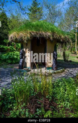African style hut with living grass roof, Bwlch-y-Geufford,Wales Stock Photo