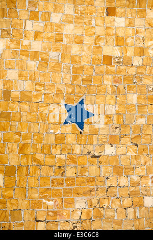 Detail of a ancient floor mosaic showing a blue five pointed star. Stock Photo