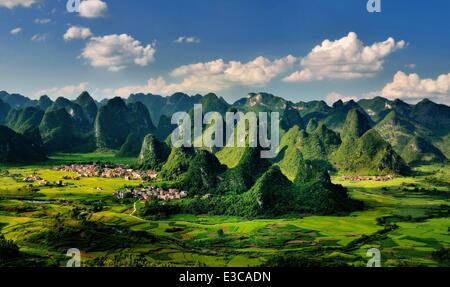 (140623) -- BEIJING, June 23, 2014 (Xinhua) -- File photo taken on July 24, 2011 shows the scenery of karst landform in Dacai Township under Maonan Autonomous County of Huaijiang, south China's Guangxi Zhuang Autonomous Region. The World Heritage Committee on Monday inscribed an extension of South China Karst, a natural World Heritage Site since 2007, into the UNESCO's World Heritage List. (Xinhua/Wang Xiufa) (mp) Stock Photo