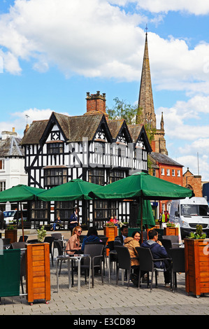 Pavement cafe in the shopping street with the High House in High Town (Built in 1621) to the rear, Hereford, England, UK. Stock Photo