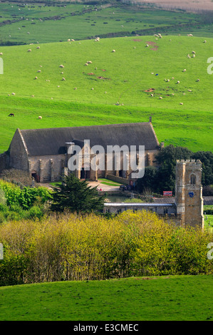 Abbotsbury church and tithe barn, Dorset. Stock Photo