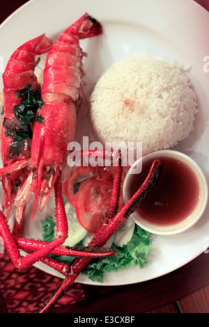 Two prawns on a plate with rice Stock Photo