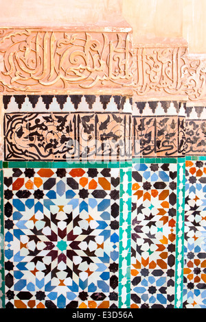 Detail of the fine carving and tile-work at the Ben Youssef Medersa in Marrakesh, Morocco, North Africa. Stock Photo