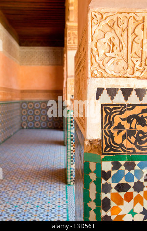 Detail of the fine carving and tile-work at the Ben Youssef Medersa in Marrakesh, Morocco, North Africa. Stock Photo