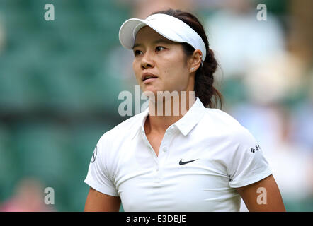 London, UK. 23rd June, 2014. Li Na of China reacts during the women's singles tennis match against Paula Kania of Poland at the Wimbledon Tennis Championships, in London, the United Kingdom, June 23, 2014. Credit:  Meng Yongmin/Xinhua/Alamy Live News Stock Photo