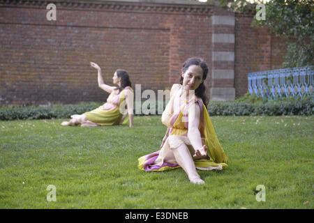 Old Westbury, New York, USA. 21st June, 2014. Lori Belilove & The Isadora Duncan Dance Company performs modern dance throughout the gardens during the Midsummer Night event at the Long Island Gold Coast estate of Old Westbury Gardens on the first day of summer, the summer solstice. © Ann Parry/ZUMA Wire/ZUMAPRESS.com/Alamy Live News Stock Photo