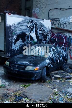 British graffiti artist Banksy gets political in his latest work in Manhattan's Lower East Side. The street artist revealed an intricate installation on Ludlow Street. Viewers said they were alarmed to hear the accompanying audio, from a 2007 raid in Baghdad. This installation is much more political than Banksy’s previous works, featuring spray-painted targets, armed soldiers and horses in night vision goggles.  Featuring: Atmosphere Where: New York City, NY, United States When: 12 Oct 2013.com Stock Photo