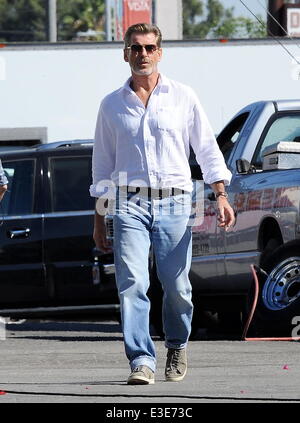 Pierce Brosnan is all smiles while walking around on the set of his new movie 'How To Make Love Like An Englishman' filming in Dowtown Los Angeles  Featuring: Pierce Brosnan Where: Los Angeles, CA, United States When: 16 Oct 2013 Stock Photo