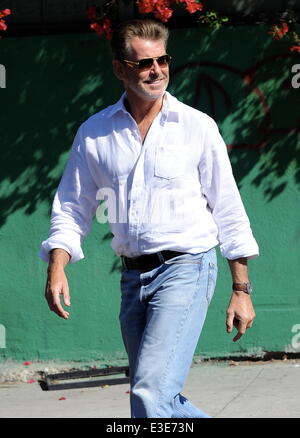 Pierce Brosnan is all smiles while walking around on the set of his new movie 'How To Make Love Like An Englishman' filming in Dowtown Los Angeles  Featuring: Pierce Brosnan Where: Los Angeles, CA, United States When: 16 Oct 2013 Stock Photo