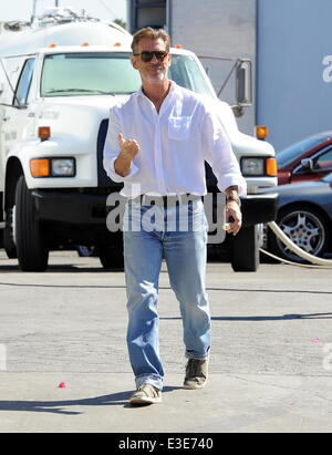 Pierce Brosnan is all smiles while walking around on the set of his new movie 'How To Make Love Like An Englishman' filming in Dowtown Los Angeles  Featuring: Pierce Brosnan Where: Los Angeles, CA, United States When: 16 Oct 2013 Stock Photo