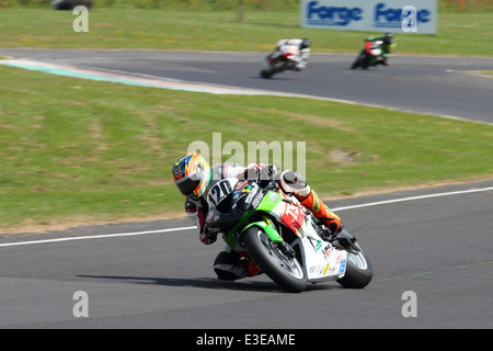 Motorcycles racing around Castle Combe Circuit at their Grand National Motorcycle Race Meeting weekend. Stock Photo