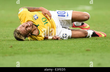 Brazil’s Neymar lies on the pitch with his face bleeding after a rough ...