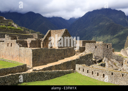 Rock block walls, ramps, grassed terraces, and the northeast buildings at Machu Picchu, Cusco, Peru. Stock Photo