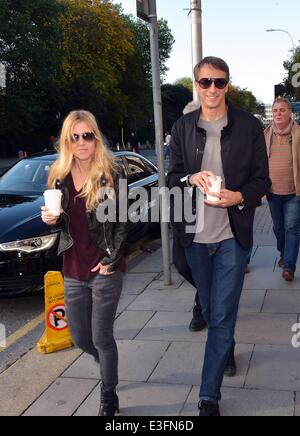 Pro Skateboarder Tony Hawk & girlfriend Cathy Goodman spotted walking with coffees at The Shelbourne Hotel...  Featuring: Cathy Goodman,Tony Hawk Where: Dublin, Ireland When: 01 Nov 2013 Stock Photo