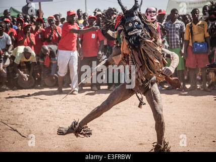 Maputo. 12th June, 2014. Photo taken on June 12, 2014 shows Nyau dancer perform in the northwestern province of Tete, Mozambique. Nyau masks are worn by only male members of the society and represent male knowledge, and are understood to be spirits of the dead during performance. Nyau is an ethnic society in western Mozambique, central and southern Malawi, eastern Zambia, and areas where Malawians migrated in Zimbabwe. © Mauro Vombe/Xinhua/Alamy Live News Stock Photo