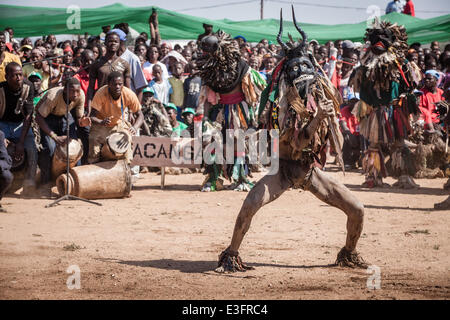 Maputo. 12th June, 2014. Photo taken on June 12, 2014 shows Nyau dancer perform in the northwestern province of Tete, Mozambique. Nyau masks are worn by only male members of the society and represent male knowledge, and are understood to be spirits of the dead during performance. Nyau is an ethnic society in western Mozambique, central and southern Malawi, eastern Zambia, and areas where Malawians migrated in Zimbabwe. © Mauro Vombe/Xinhua/Alamy Live News Stock Photo