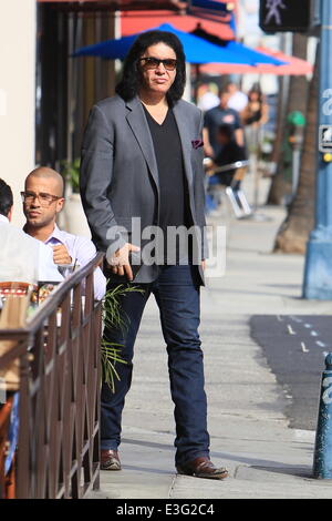 Gene Simmons seen leaving Panini Cafe in Beverly Hills. He goes to his car to show the photographers an award he was recently given, The Charles Durning Award. Gene then poses for a picture with a young fan and gives the fan his sunglasses for the shot. Stock Photo