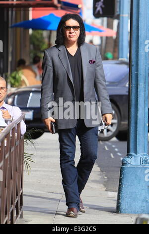 Gene Simmons seen leaving Panini Cafe in Beverly Hills. He goes to his car to show the photographers an award he was recently given, The Charles Durning Award. Gene then poses for a picture with a young fan and gives the fan his sunglasses for the shot. Stock Photo