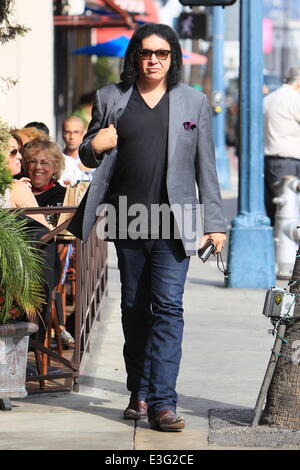 Gene Simmons seen leaving Panini Cafe in Beverly Hills. He goes to his car to show the photographers an award he was recently given, The Charles Durning Award. Gene then poses for a picture with a young fan and gives the fan his sunglasses for the shot. Stock Photo